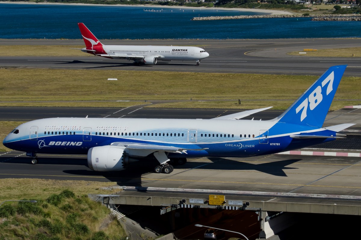 The old and the new: A Boeing 787 and Qantas Boeing 767 pass at Sydney Airport