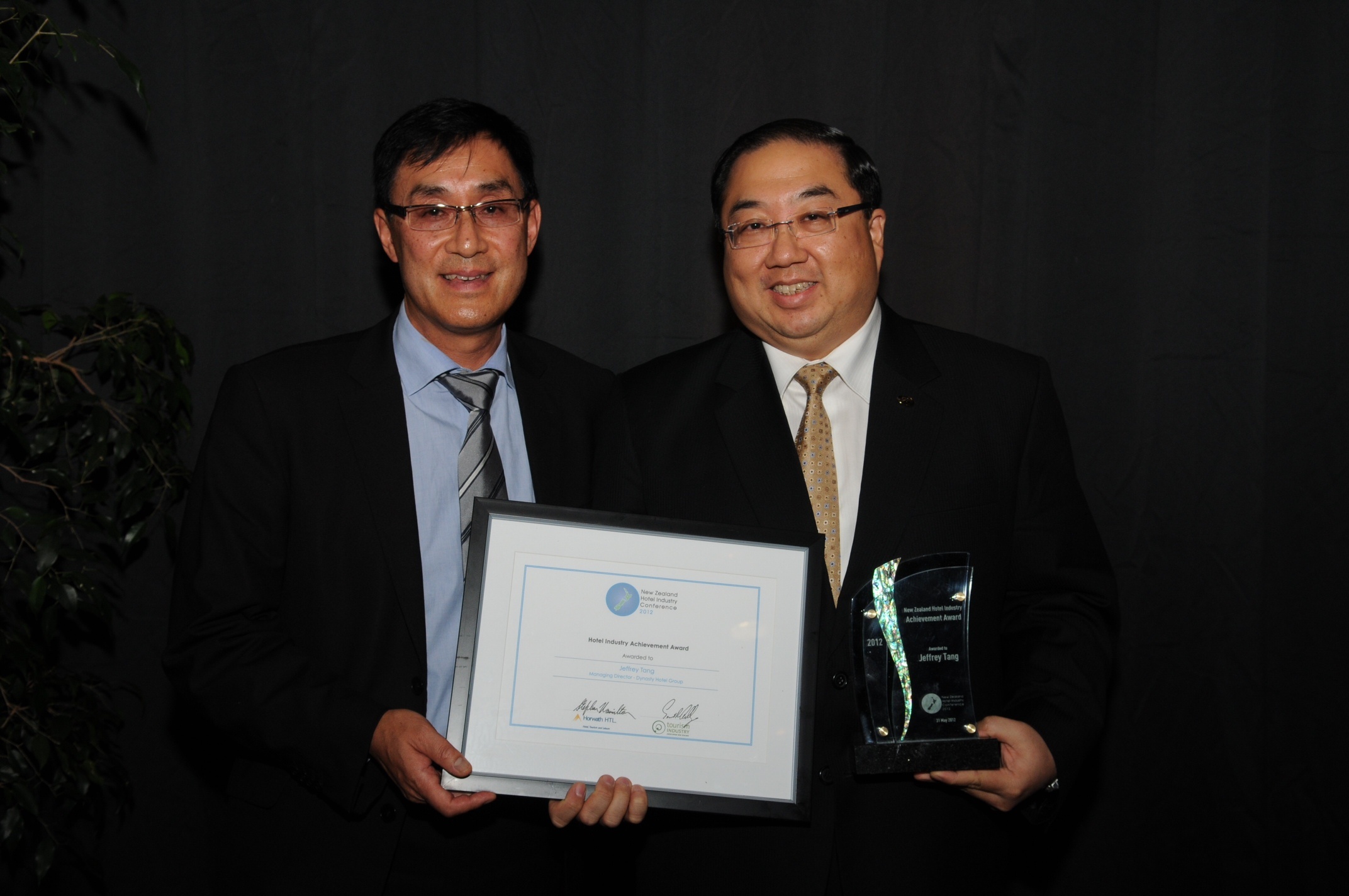 Horwath HTL's Terry Ngan presents the Industry Achievement Award to Jeffrey Tang